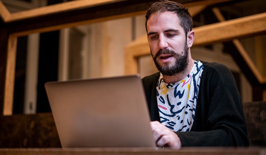 Man studying with a laptop